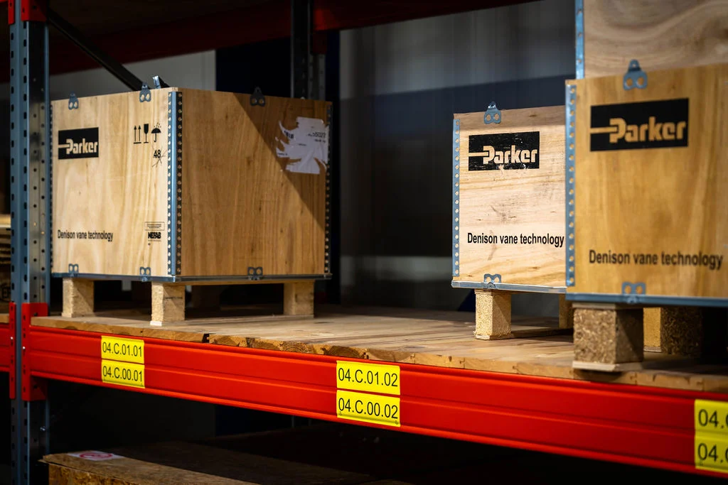 Storage shelves at DTA Hydraulics with Parker Denison equipment and parts